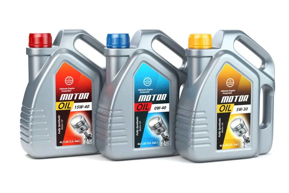 An array of different types of lawn mower oils.