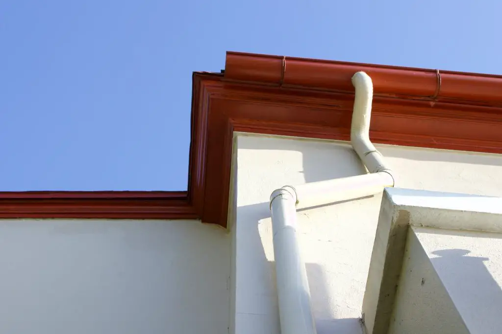 A downspout connecting to a gutter.