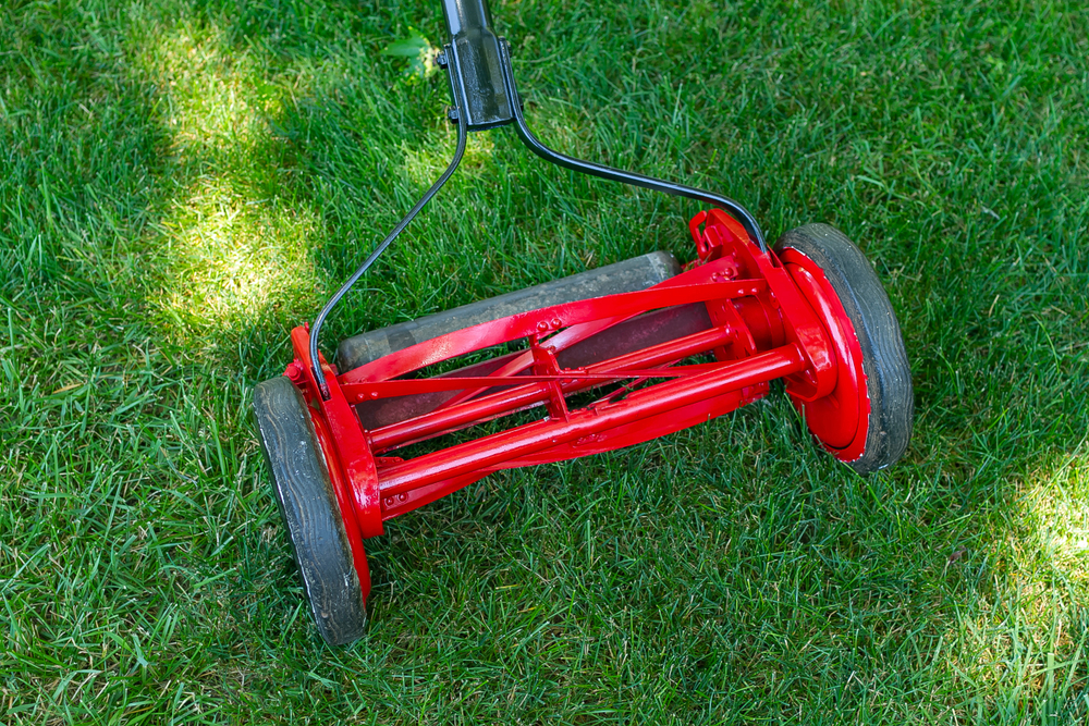 A red reel lawn mower.