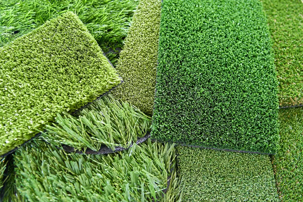 Patches of artificial grass with different colors and lengths.